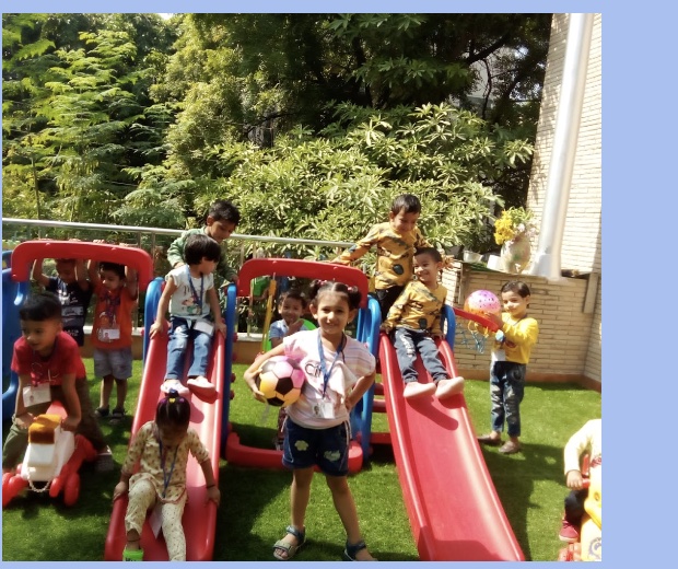 Children enjoying supervised outdoor play at First Step School