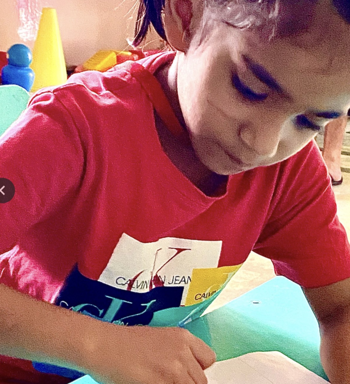 Grade 1 child focused on writing activity